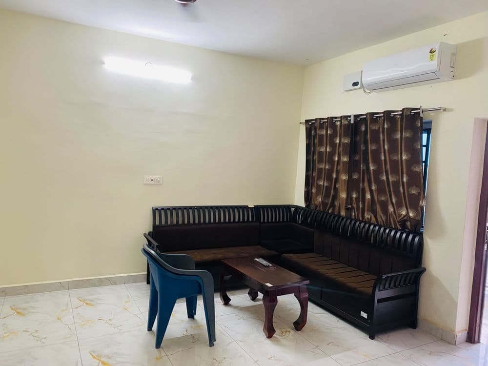 2BHK suite shared living area with sofa